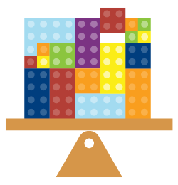 Colorful building blocks balance on a scale.