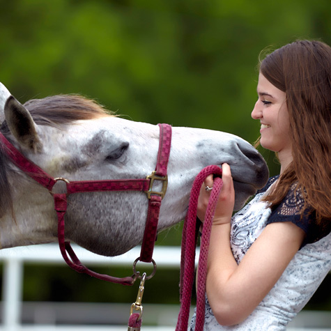 image of a woman with an adopted horse